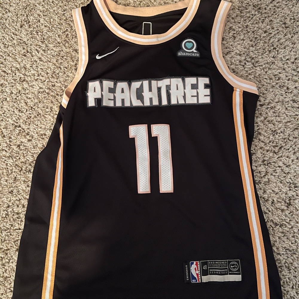 Trae young peach tree jersey